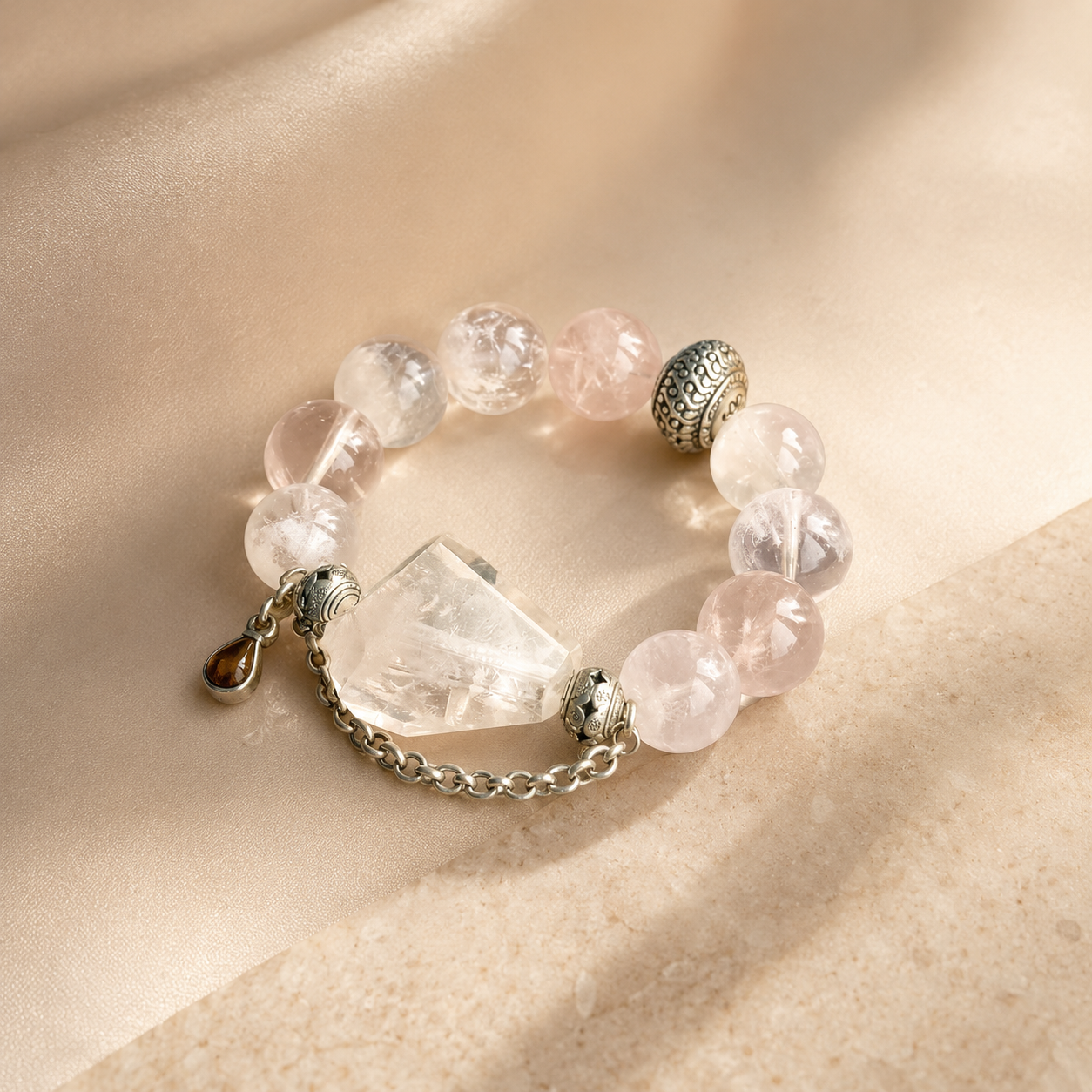 Soft pink and clear crystal bracelet with a central crystal pendant
