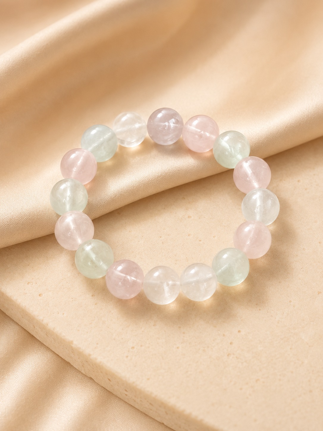 Pastel crystal bracelet on a soft beige background for everyday styling